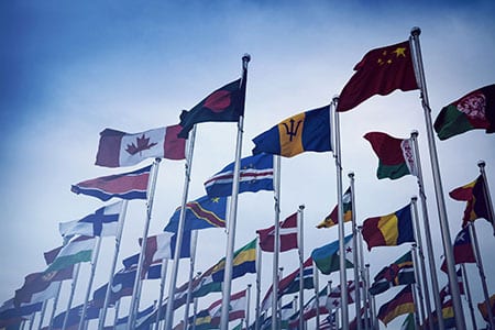 Different flags of the world waving in the wind.